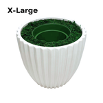 Image of an extra-large glossy white ribbed ceramic container, containing faux moss and a green nursery pot, shown as House of Silk Flowers' pot-in-a-pot system.