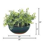 Artificial hanging plant with white flowers and green leaves on a white background