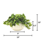 Artificial green plant in a white pot with dimensions labeled on a white background