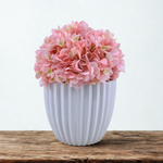 Artificial Hydrangea in pink in a Glossy White Ceramic, on a wood counter on a white background, by House of Silk Flowers 