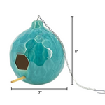 Turquoise birdhouse with chain and measurements on a white background
