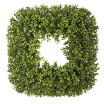 Artificial boxwood wreath on a white background