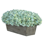Teal hydrangea in rectangular grey ledge on white background
