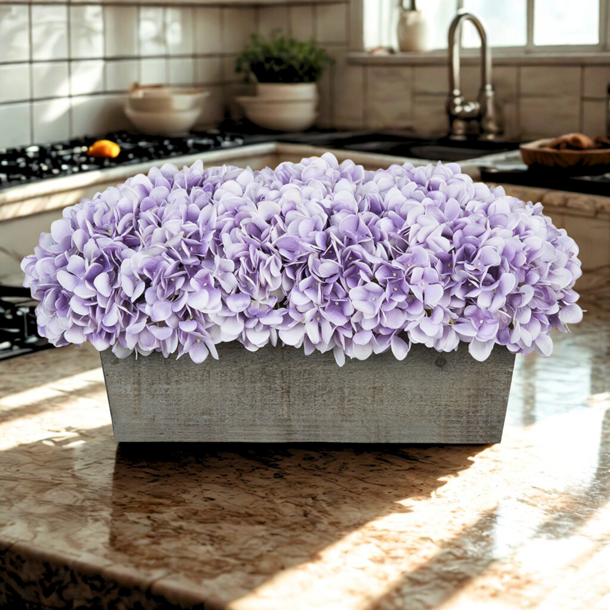 Violet hydrangeas in rectangular grey ledge in kitchen