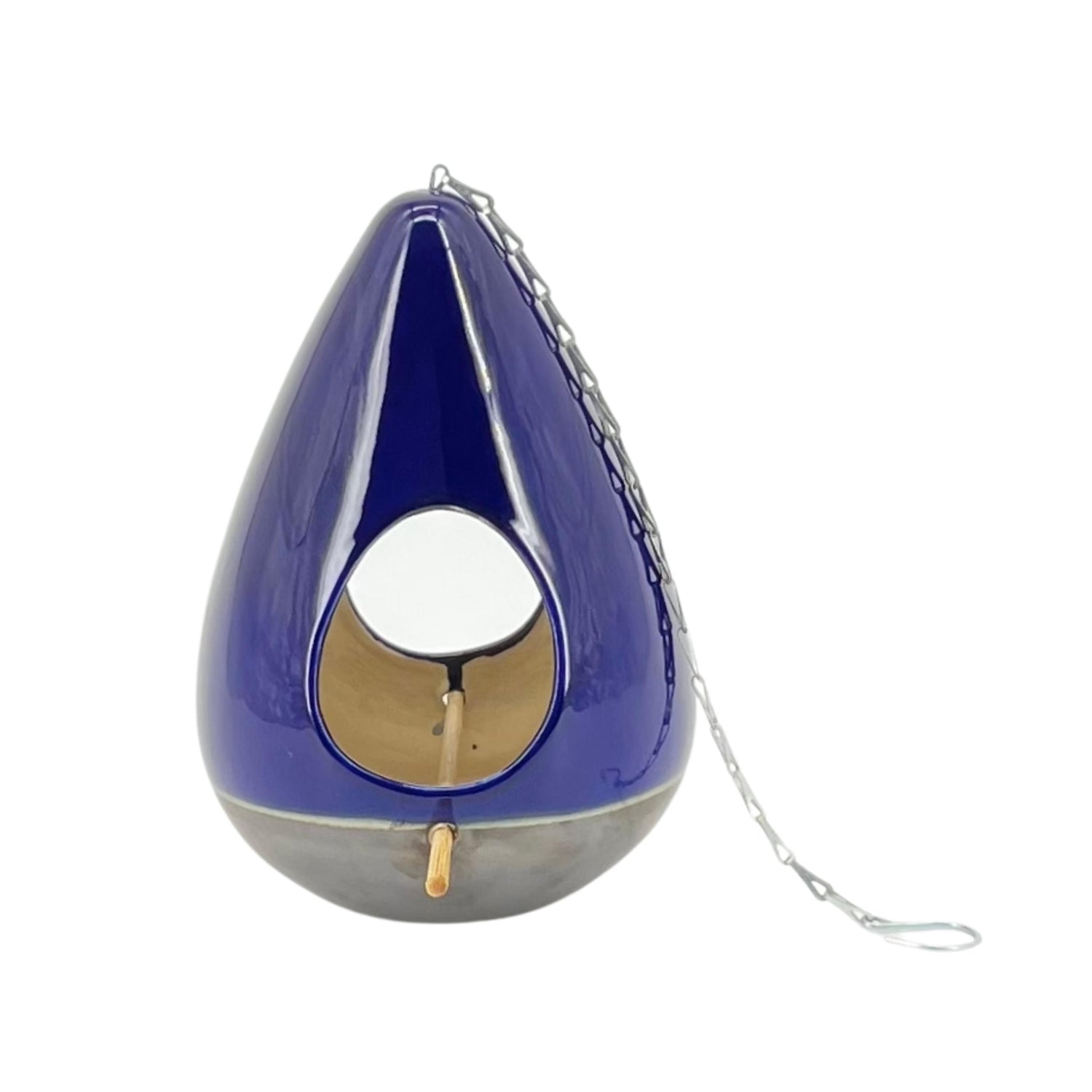A blue ceramic teardrop-shaped birdhouse with a metal chain attached to it for hanging.