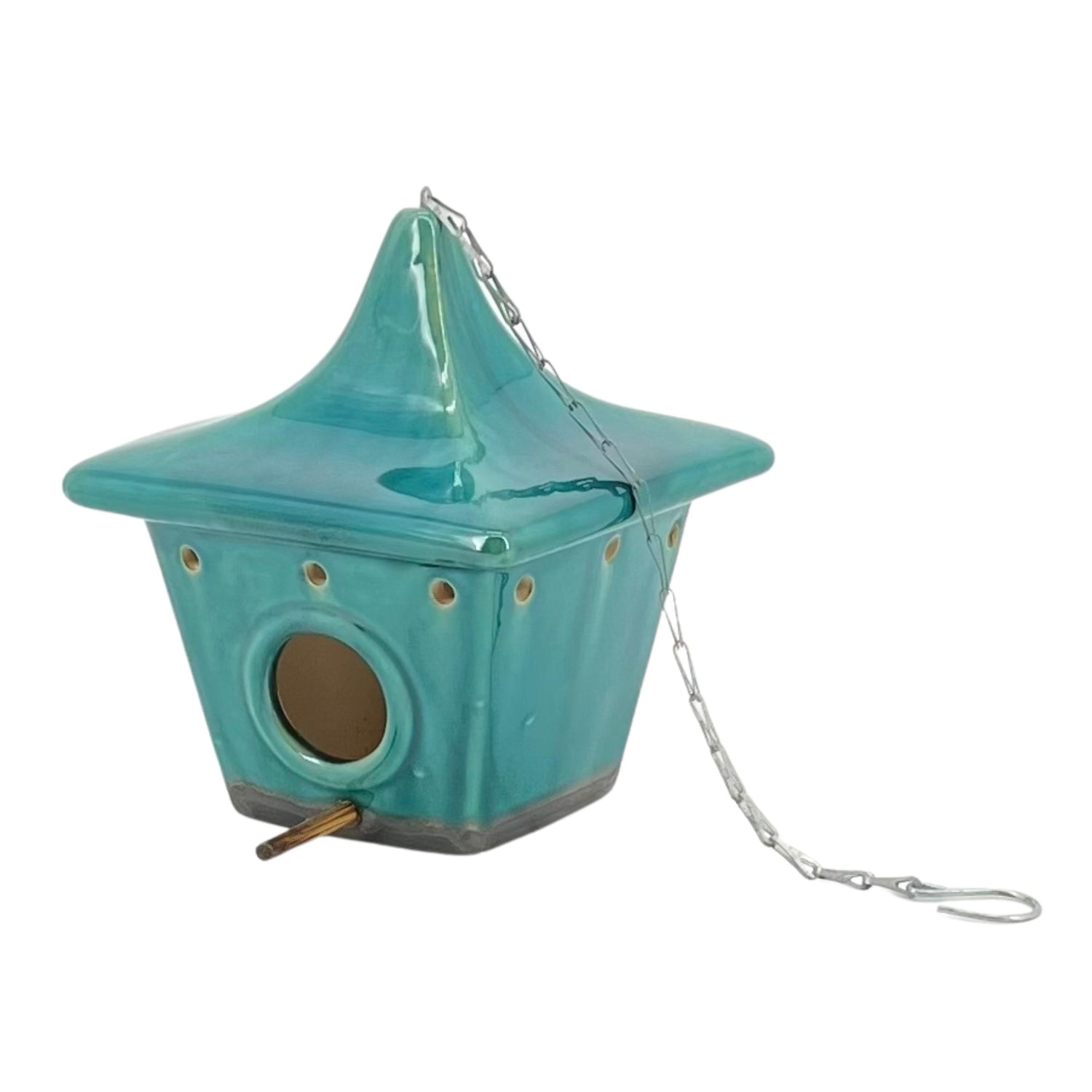 A blue ceramic square pagoda-shaped birdhouse with a metal chain and hook for hanging.