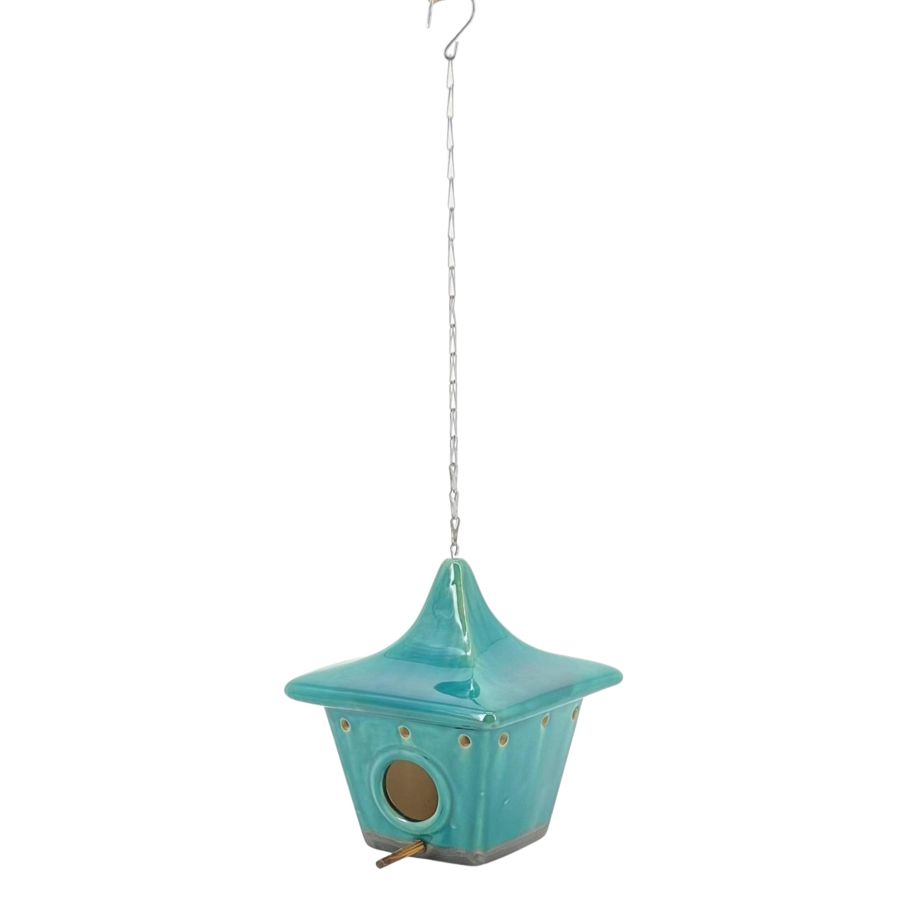 A blue ceramic square pagoda-shaped birdhouse with a metal chain and hook for hanging.