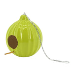 A green ceramic round ruffled birdhouse with a metal chain and hook for hanging.