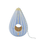 Reactive blue ceramic teardrop-shaped birdhouse with a ruffled design, featuring two large openings, a metal chain for hanging, and a gold-colored interior.