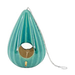 A red ceramic teardrop-shaped birdhouse with a ruffled design, featuring two large openings, a metal chain for hanging, and a gold-colored interior.