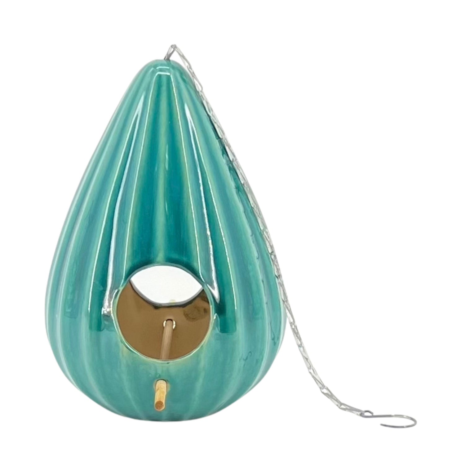 A red ceramic teardrop-shaped birdhouse with a ruffled design, featuring two large openings, a metal chain for hanging, and a gold-colored interior.