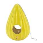 A Yellow ceramic teardrop-shaped birdhouse with a ruffled design, featuring two large openings, a metal chain for hanging, and a gold-colored interior.